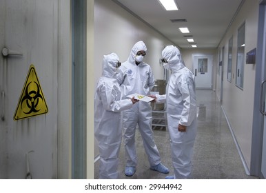 Bio hazard scientists receiving a confidential document