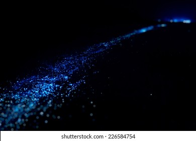 Bio Luminescence. Illumination Of Plankton At Maldives. Many Bright Particles.
