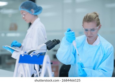 In a bio manufacturing facility, scientists develop a personalized mRNA vaccine, using a digital tablet to guide the precise formulation for a next generation gene therapy treatment.