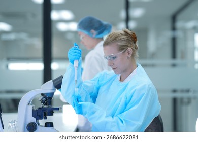 In a bio manufacturing facility, scientists develop a personalized mRNA vaccine, using a digital tablet to guide the precise formulation for a next generation gene therapy treatment.