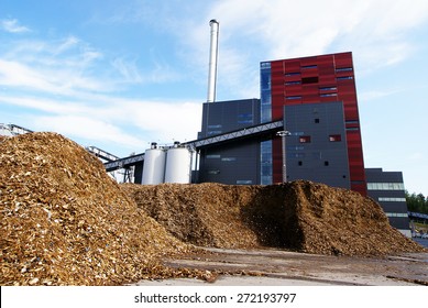 Bio Power Plant With Storage Of Wooden Fuel (biomass) Against Blue Sky