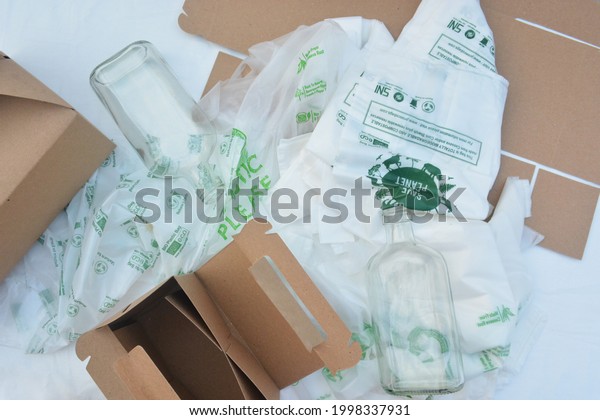 Biodegradable eco friendly packaging cassava bag\
plastic glass bottle cardboard box - Jakarta, Indonesia - Thursday\
11 June 2020