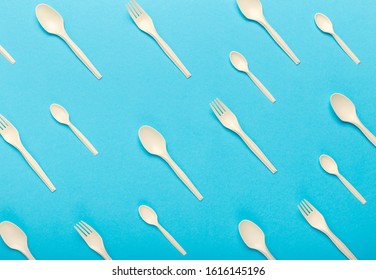 Biodegradable material. Seamless pattern of bioplastic single use cutlery isolated on blue background