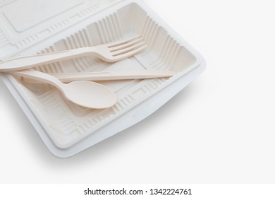 Biodegradable plastic lunch box, spoon and fork on white background isolate with clipping path