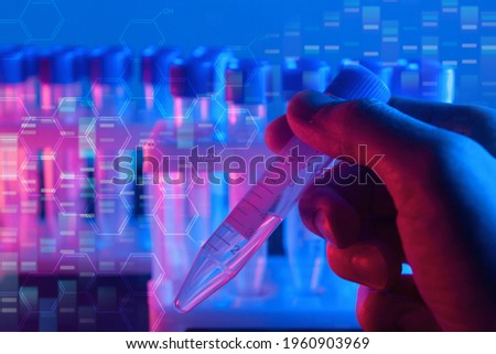 bioengineering, genetic engineering, biotechnology laboratory research concept, hand holding test tube in red blue background