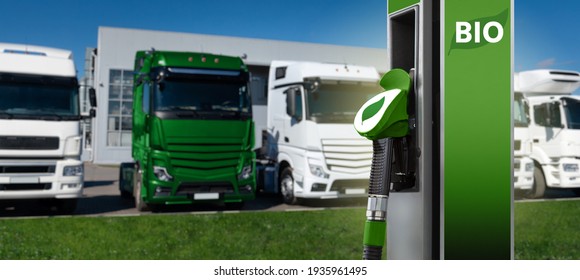 Biofuel filling station on a background of trucks. One truck green.