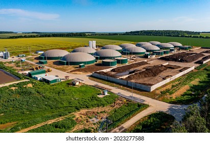 Biogas Station At The Green Large Field. Distillation Process Is Used To Produce Bio Gas At Station. View From Above