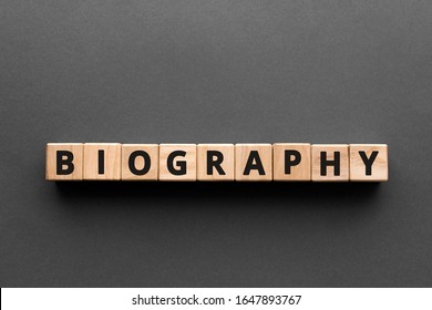 Biography - Words From Wooden Blocks With Letters, The Life Story Biography Concept, Top View Gray Background