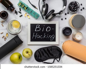 Biohacking Flat Lay Concept. Top-down View Of Still Life And Word Bio Hacking On Chalkboard