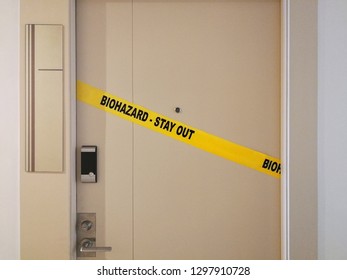 Biohazard Crime Scene Tape On Door For Home Quarantine