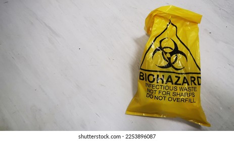 Biohazard disposal trash bag on the gorund                   