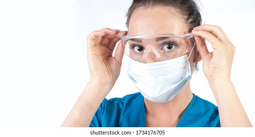 Biologist Doctor Nurse Hospital Worker.isolated On White Background.Female Doctor Or Nurse Wearing Medical Protective Mask And Glasses On Face. Protection For Coronavirus COVID-19