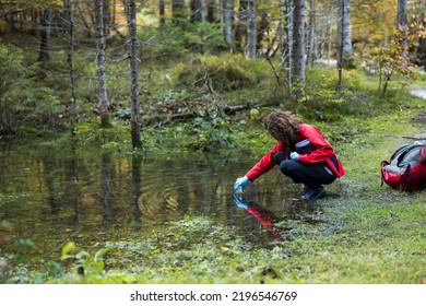 Biologist Environmentalist Woman Taking Samples of Water and Soil in a Forest Environment - Shutterstock ID 2196546769