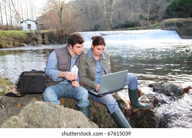 Biologists Testing Water Of Natural River