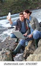 Biologists Testing Water Of Natural River