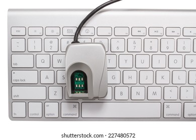 Biometric Fingerprint Scanner On A Keyboard Isolated On A White Background