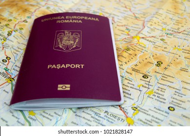 Biometric Romanian Passport Placed On A Map.