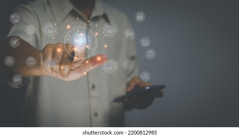 Biometric technology concept,Accessing personal data with connection security , man touching icon to scan fingerprints on the virtual screen to log in for online transactions with the Internet.