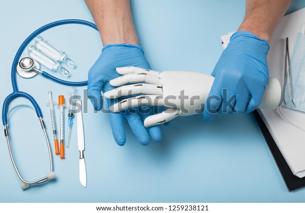 Bionic\
medical hand prosthesis. Amputation of\
arm.
