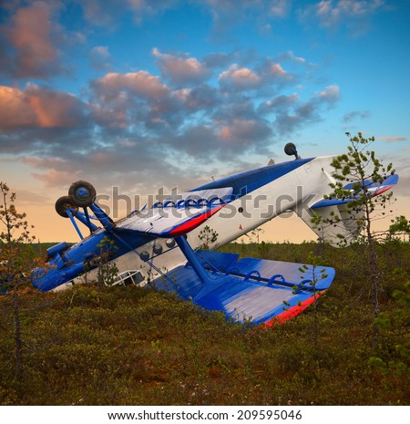 Biplane had crashed in marsh due to engine failure. Plane had rotation after emergency landing on the marsh. It lay up landing gear.