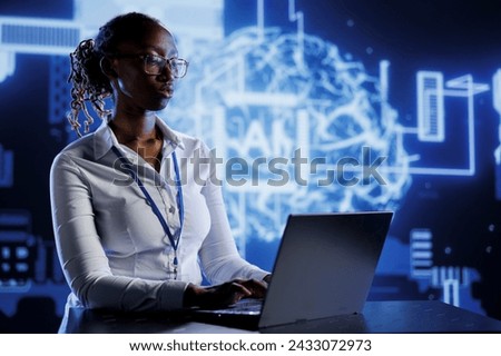 BIPOC woman developing artificial intelligence neural networks nodes modeled after human brain. Tech support setting up AI machine learning accurately making predictions using data