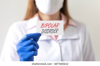Bipolar disorder inscription in doctor hands close up. - Shutterstock ID 1877605612