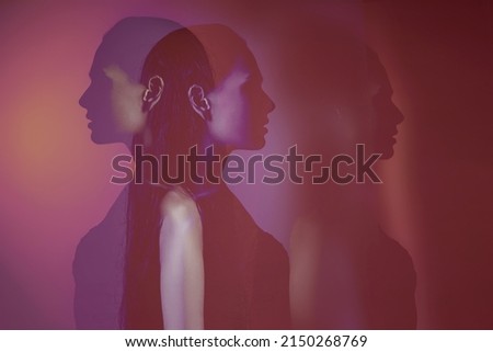 bipolar mental disorder. Double face. Split personality. Conceptual mood disorder. Dual personality concept. 2 silhouettes of a female head. mental health. Imagination. red