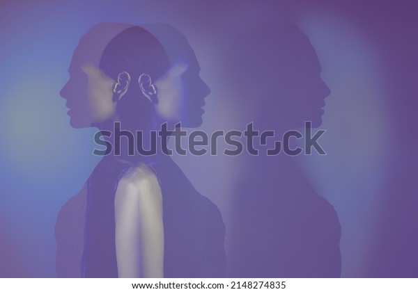bipolar mental disorder.\
Double face. Split personality. Conceptual mood disorder. Dual\
personality concept. 2 silhouettes of a female head. mental health.\
Imagination.
