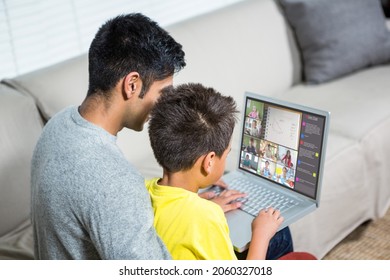 Biracial boy with father using laptop for video call, with elementary school pupils on screen. communication technology and online education, digital composite image. - Powered by Shutterstock