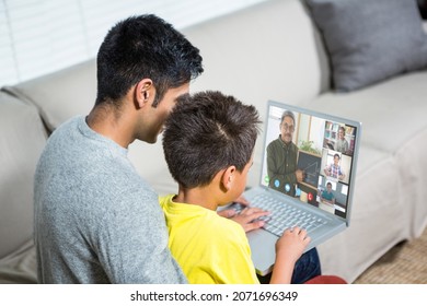 Biracial boy with father using laptop for video call, with diverse high school pupils on screen. communication technology and online education, digital composite image.