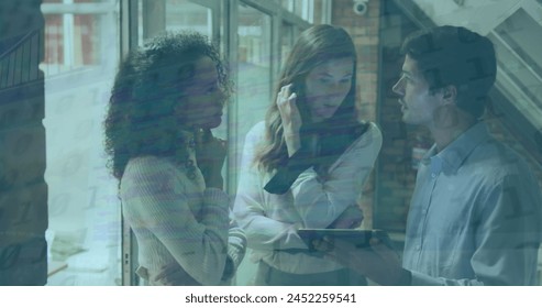 A biracial businesswoman and a caucasian businessman discussing and smiling while looking at a digital tablet together. global business digital interface communication and data processing concept. - Powered by Shutterstock