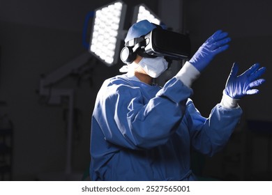 Biracial female surgeon wearing surgical gown using vr headset in operating theatre. Medicine, healthcare, surgery, technology, work and hospital, unaltered. - Powered by Shutterstock