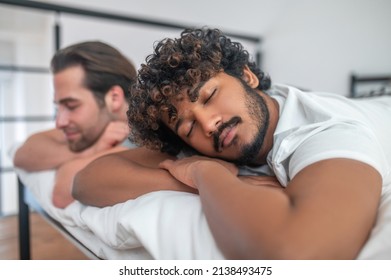 Biracial Gay Couple Sleeping In The Bedroom
