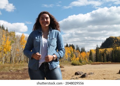 Biracial Samoan Female Enjoying The Fall Forest Outdoors