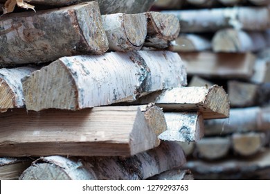 Birch Firewood Near The Furnace Firebox. Stabbed Bundles Lying Near The Stove Of Red Brick