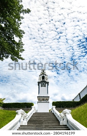 Birch Memorial Clock Tower in Ipoh, Perak, Malaysia, with colonial buildings and blue sky