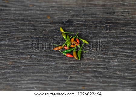 Bird chili ,Thai chili on brown wooden table