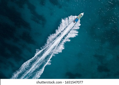 Bird Eye View Of Motor Boat With Wake At Sea