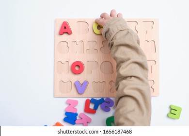 Bird Eye View Of Preschooler, Kindergarten Boy Playing With Alphabet Blocks, Children Learning English With Wooden Educational Abc Toy Puzzle, Teach Young Kids English At Home, Selective Focus