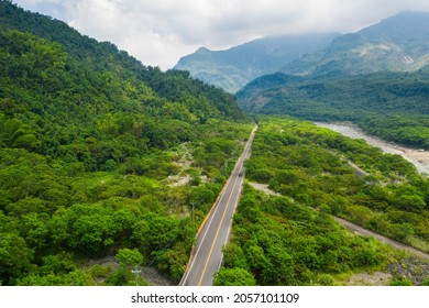 Bird eye view of Taiwan valley -Aerial view and colorful landscape with sky, cloud, hill, river,valley and road; use the drone in morning, shot in Namasia, Kaohsiung, Taiwan. - Shutterstock ID 2057101109