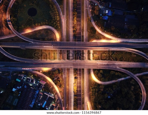 Bird eye view of traffic cross road at sunset\
twilight, view from drone\
photography