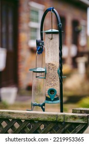 Bird Feeder On The Fence Next To The House At Jersey Island UK