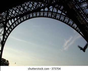 Bird Flying under Eiffel Tower - Powered by Shutterstock - Get 15% off with code: PIKWIZARD15