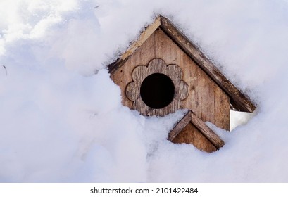 Bird House Buried In A Snow Drift.