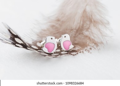 Bird Shape With Pink Heart Earring Studs On White Background With Feather. Cute Jewelry For Child Girl. Present For Birthday