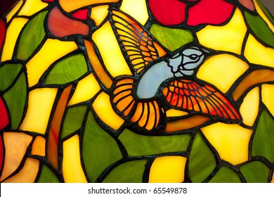 A Bird In Stained Glass Of  Lamp.