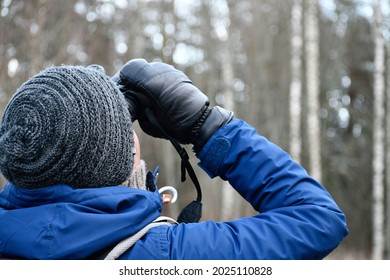 Bird Watcher With Binoculars In Winter