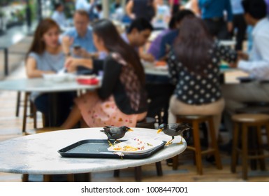 Birds Eat The Livings Of A Food At Food Court In Singapore