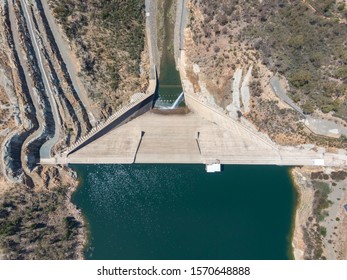 Bird's eye aerial view of Cotter Dam wall & Cotter reservoir, a supply source of potable water for the city of Canberra in the Australian Capital Territory, Australia. Low water levels due to drought.