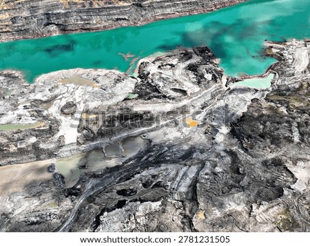 Bird's Eye View of Active Mining Sector with Sedimentation Ponds and Overburden Removal Areas